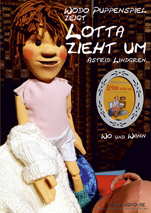 Foto von der Marionette Lotta mit einem weißen Pullover in der Hand